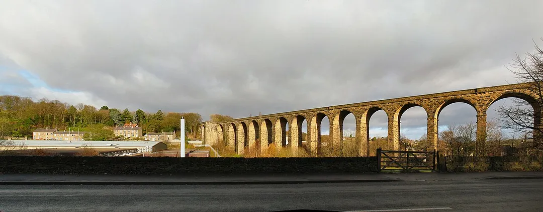 The Parish Council's website says Denby Dale Viaduct "strides across the Dearne Valley".
Especially dramatic in low winter sunlight - and after heavy rain. (Photo from Barnsley Road - looking northeast.) 
____________________________
(An experiment in stitching several photos. 

To view large and original, Click here.