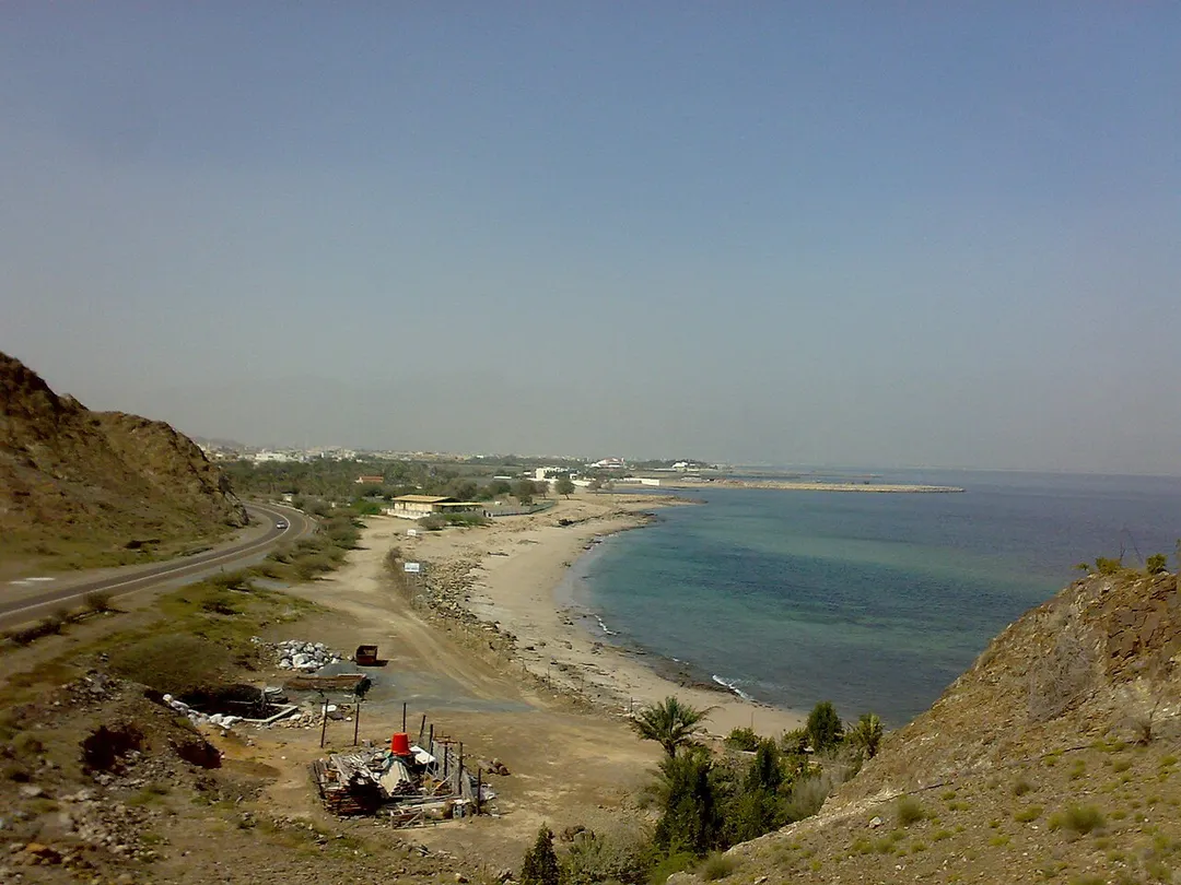 View of Rul Dibba from cape 6 km east of Dibba city, emirate of Fujeirah, northeastern UAE. In the background, dimly visible, are the mountains of Musandam, in the Sultanate of Oman.
