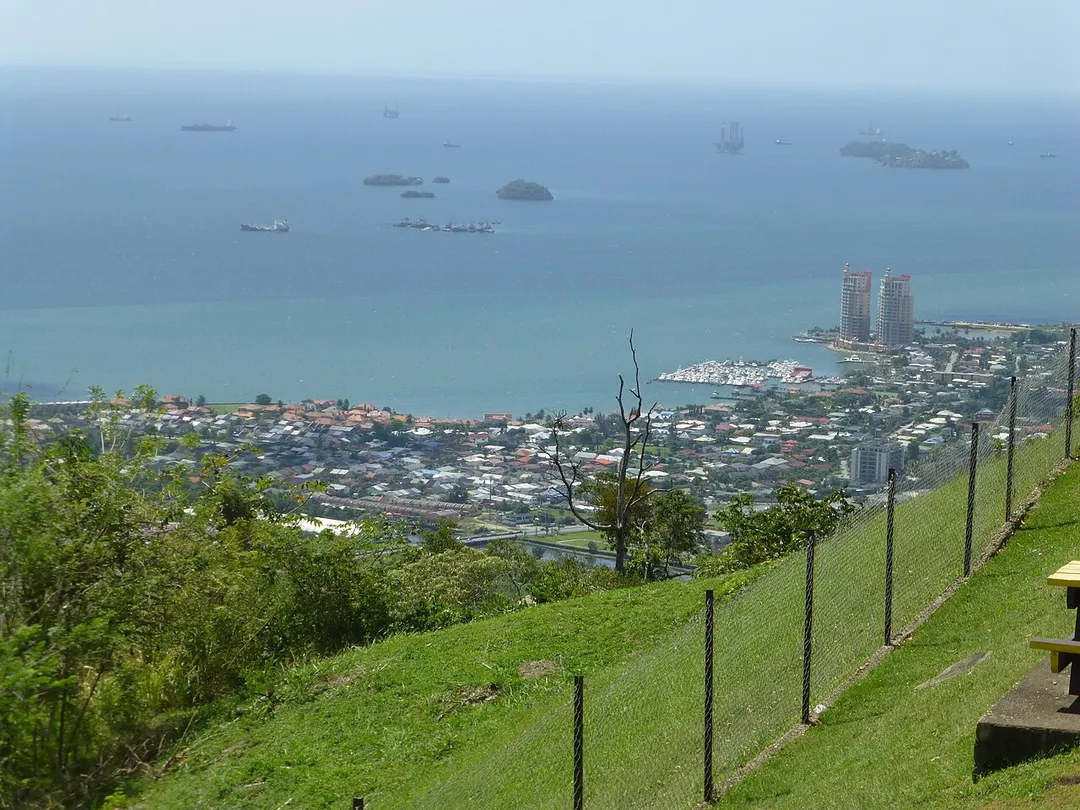 View to the southwest from Fort George, Port of Spain, Trinidad and Tobago. Left: Westmoorings. Right (with yacht club and The Renaissance towers): Glencoe. Islands in the middle: Five Islands. Islands top right: Diego Islands (Carrera in front, Cronstadt behind).
