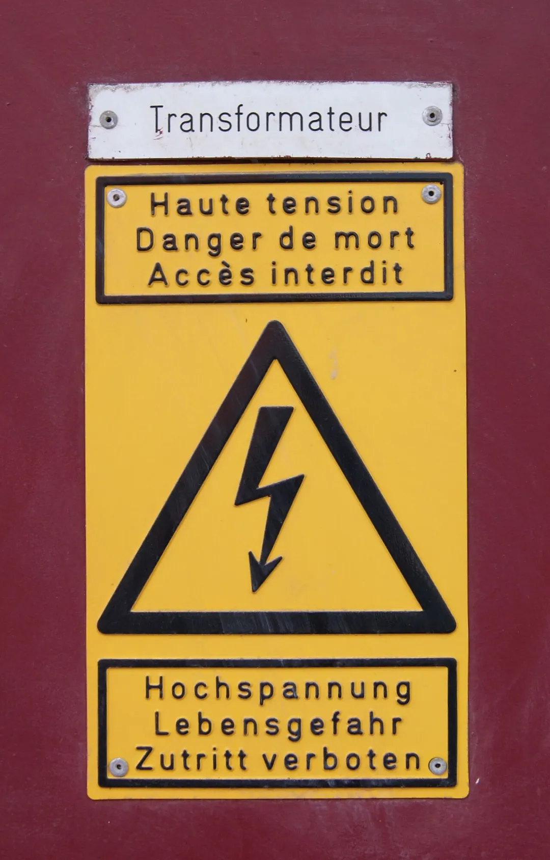 Yellow warning sign high voltage - danger to life in Differdange. Differdange (luxembourg: Déifferdeng 'or Déifferdang, french: Differdange, german: Differdingen) is a town and a municipality in the canton of Esch-sur-Alzette in the Grand Duchy of Luxembourg.