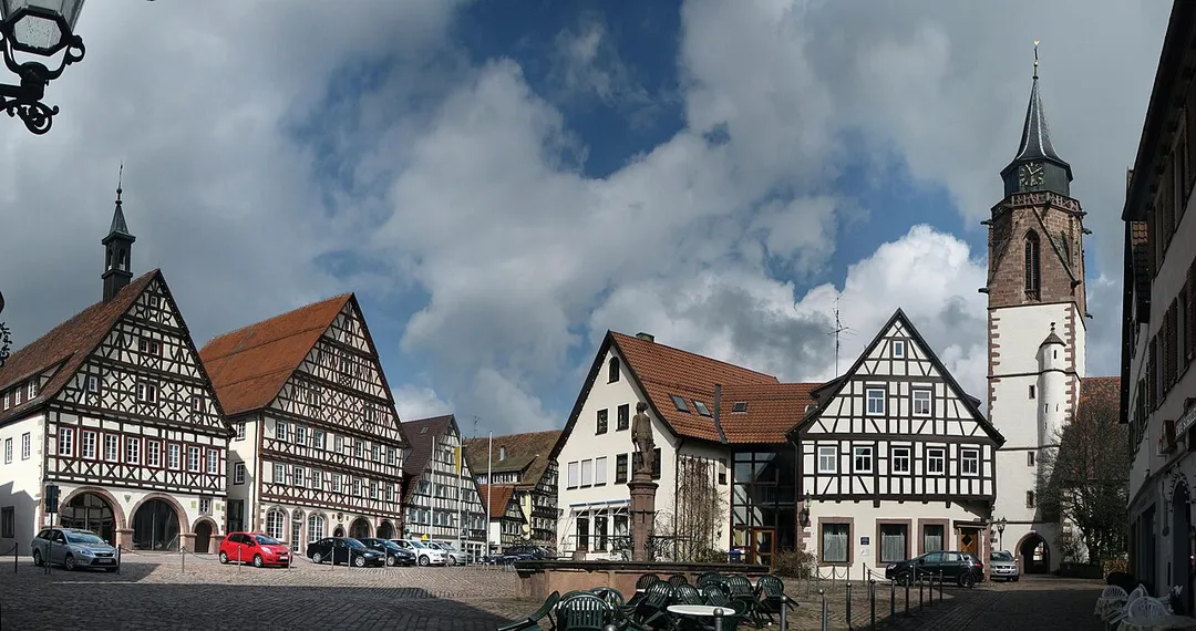 Market square and half-timbered buildings in Dornstetten , Baden-Württemberg, Germany. In foreground market place fountain; background town-hall, guest-house oxen, old schoolhouse, old vicarage and Martin church.
