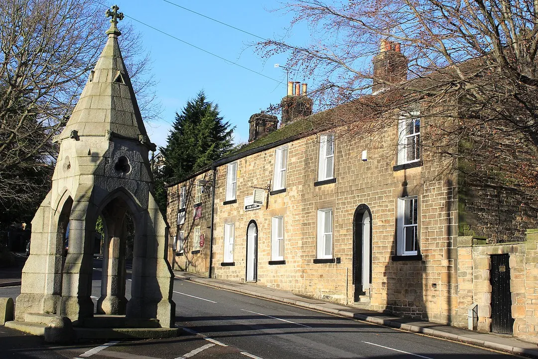 Peel Monument and High Street, Dronfield, Derbyshire, England. Image taken 26 December 2016.