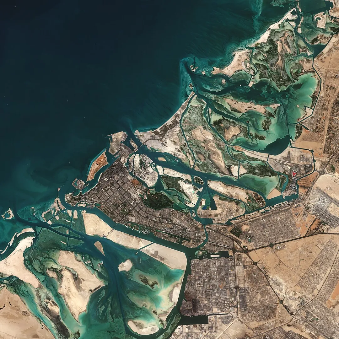 The Copernicus Sentinel-2 mission takes us over part of Abu Dhabi – one of the seven emirates that constitute the United Arab Emirates (UAE).
Covering an area of approximately 67 000 sq km, the Emirate of Abu Dhabi is the largest emirate in the UAE – accounting for around 87% of the total land area of the federation. Abu Dhabi has around 200 islands lying along its 700 km long coastline.
The city of Abu Dhabi, after which the emirate is named, is located on an island in the Persian Gulf and can be seen slightly below the centre of the image. Abu Dhabi is the capital and the second-most populous city of the UAE – after Dubai. The city is directly connected to the mainland by three bridges: Maqta, Mussafah and Sheikh Zayed.
Just east of the city lies the Mangrove National Park, visible as a dark green patch of land. The protected area is around 20 sq km and includes mangrove forests, salt marshes, mudflats and is home to more than 60 bird species.
The waters surrounding Abu Dhabi are said to hold the world’s largest population of Indo-Pacific humpback dolphins. The lighter aqua colours are shallow waters, which contrast with the dark coloured waters of the Gulf.
The iconic red roof of Ferrari World can be seen in the centre-right of the image. The Ferrari-themed park is located on Yas Island and is said to be the world’s largest indoor theme park. Abu Dhabi International Airport is visible southeast of the park.
Sentinel-2 is a two-satellite mission to supply the coverage and data delivery needed for Europe’s Copernicus programme. The mission’s frequent revisits over the same area and high spatial resolution allow changes in water bodies to be closely monitored.
This image, captured on 27 January 2019, is also featured on the Earth from Space video programme.

Credits: contains modified Copernicus Sentinel data (2019), processed by ESA, CC BY-SA 3.0 IGO