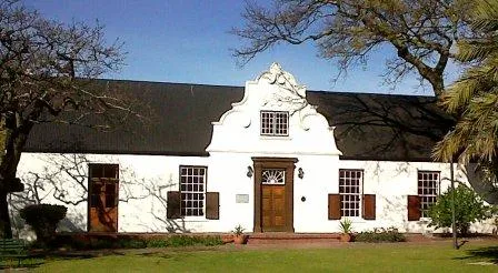 Rust-en-Vrede was originally built in the 1840’s as a prison and police headquarters. It also served as a magistrate’s court. It is here that the first Village Management Committee meetings were held. In 1901, with the registering of Durbanville as a Municipality, the first council meetings were also held in the building.
http://www.rust-en-vrede.com/about.html
