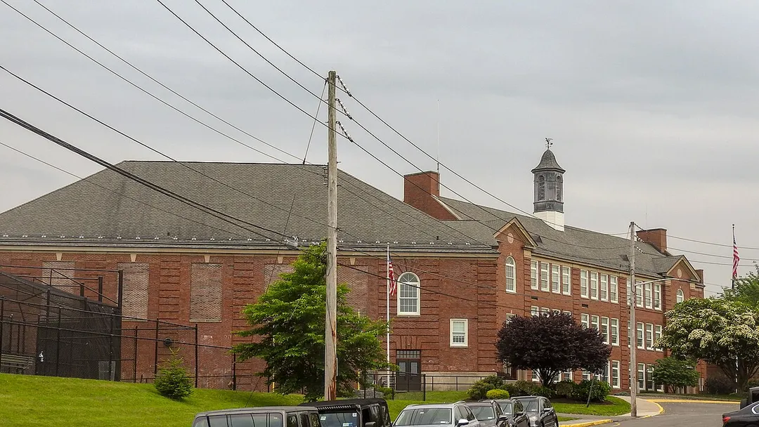 Looking south at schoolhouse on a cloudy afternoon