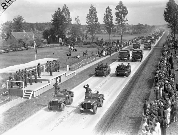 The Irish Regiment of Canada passes the saluting base during Gen. H.D.G. Crerar's review at Eelde airport.
