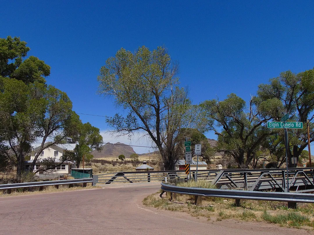 Elgin, Arizona in 2016, from across Babocomari Creek near the old church. Historic section house, water tank and pumphouse in center/left. The railroad depot would have been just to the right of the pumphouse at center, but has since been demolished.