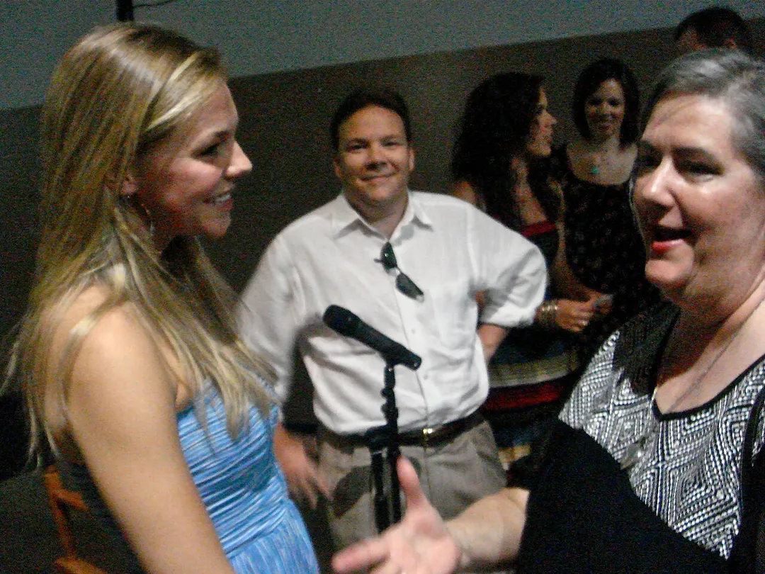 Eloise Mumford talks to fans during a sneak showing of the pilot for the short-lived TV series "Lone Star" in the lobby of the Studios at Las Colinas where the series shot in Texas.