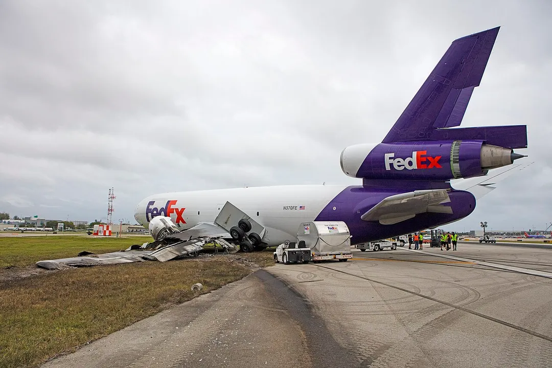 The final resting position of a FedEx MD-10-10F after it left the runway following the collapse of the left main landing gear during an attempted landing at Ft. Lauderdale-Hollywood International Airport is depicted in this Oct. 29, 2016, photo of the accident site. (NTSB Photo by Dan Bower)