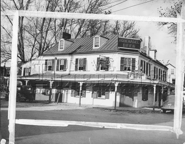 . Image shows the exterior of the Old Fox Chase Hotel, long a familiar landmark at the bending intersection of Oxford Avenue and Pine Road, near Rhawn. The hotel, built in 1705, developed a thriving stage coach business with the opening of the Fox Chase and Huntingdon Turnpike in 1848. Before 1870 it was owned by Elijah Hoffman, who operated it for many years. The hotel was sold and razed in 1940 to make way for a gasoline station. The photo was reprinted by the Evening Bulletin on April 1, 1967