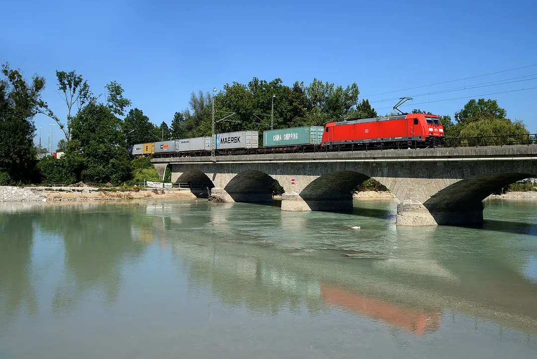 Electric locomotives 185 353 of the German railway company "Deutsche Bahn AG" on the bridge over the Saalach river near Salzburg. The bridge connects Wals-Sieznehiem, a village in the Austrian state of Salzburg (next to the border with the city of Salzburg) with the German town Freilassing.