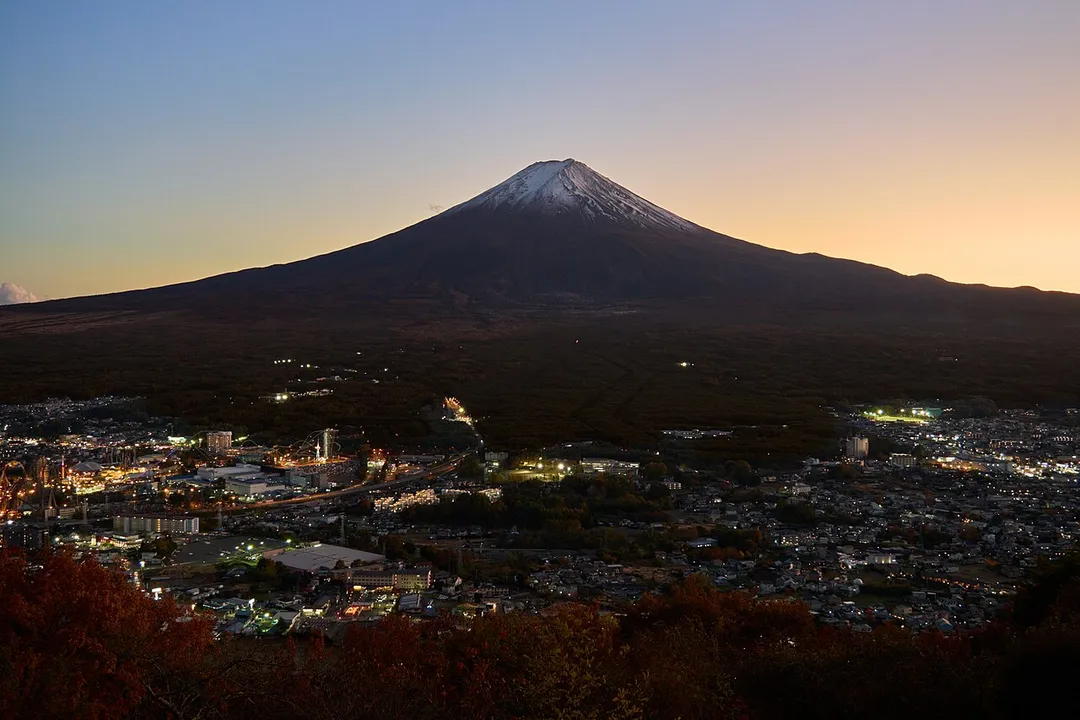 Mount Fuji rises above the city of Fujiyoshida, Yamanashi.