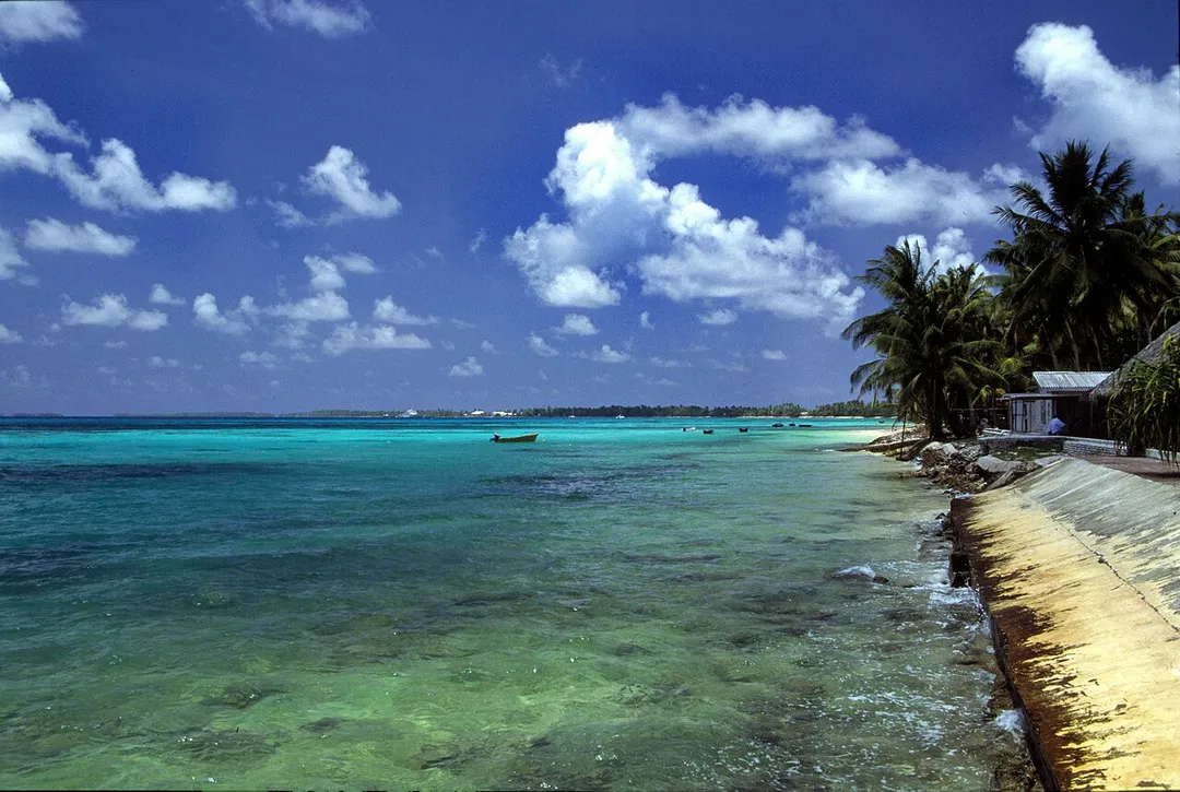 A beach at Funafuti atoll, Tuvalu, on a sunny day.