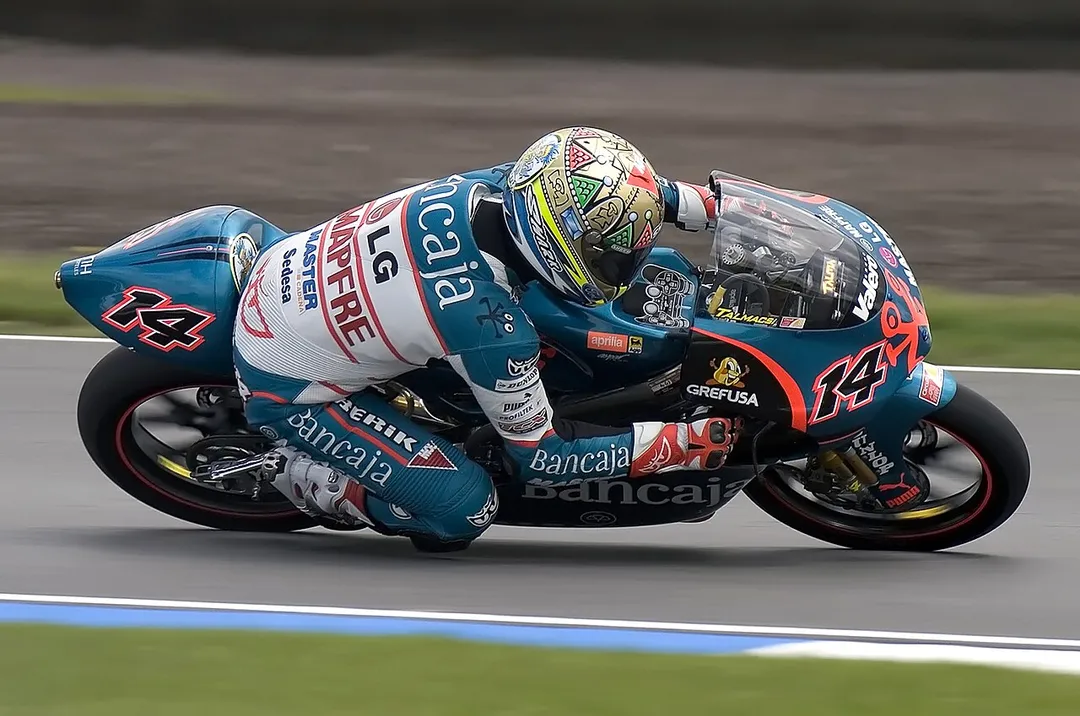 Gábor Talmácsi World Championship winner Hungarian motorcycle racer with the number 14 driving for the Bancaja Aspar Team on an Aprilia 125 cc. The shot is during second qualifying session of the 2007 British GP at Donington.