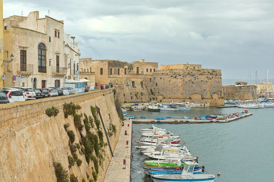 Gallipoli (Apulia, Italy) - Esat coast of the city center : fishing harbour, walls,  and the castle in the background