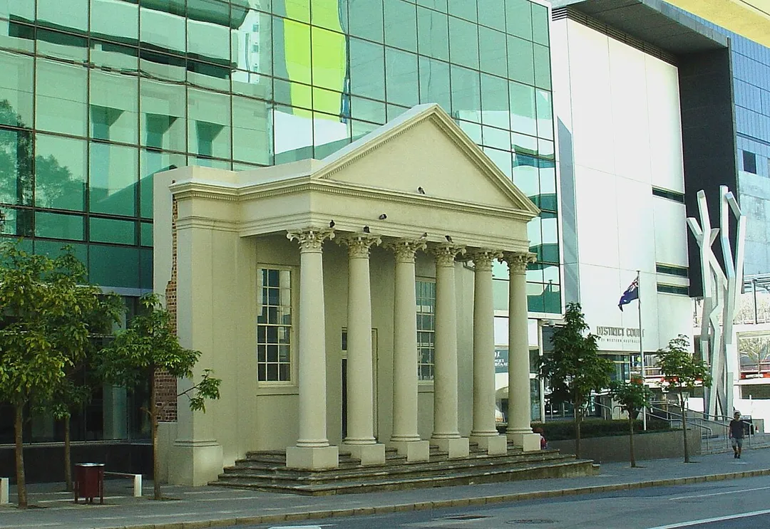 St George's Hall, a Victorian-era theatre in Perth, Western Australia, was demolished in the 1980s.  The portico was retained and now fronts the 2008 District Court building