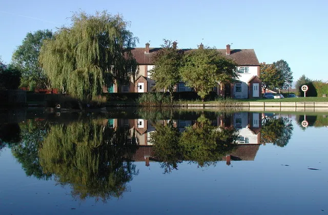 Jubilee Pond, Gilberdyke, East Riding of Yorkshire, England.Looking west-southwest across Jubilee Pond towards houses on the south side of Flaxmill Walk.