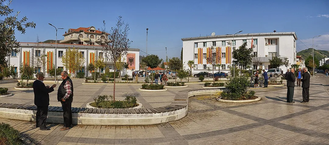 The main square of Gramsh, Albania with the Municipality Hall on the right, the City Museum on the left