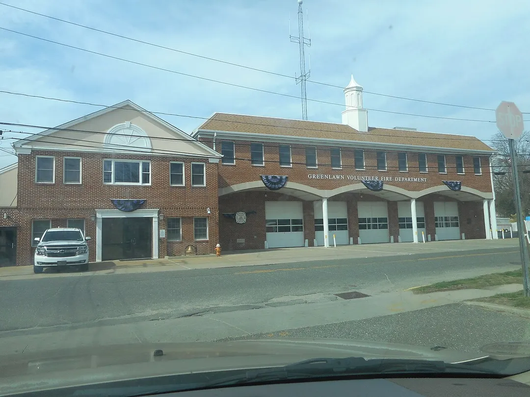 The Greenlawn Volunteer Fire Department headquarters on Boulevard Avenue as seen from the exit of the Greenlawn Long Island Rail Road station in Greenlawn, New York.