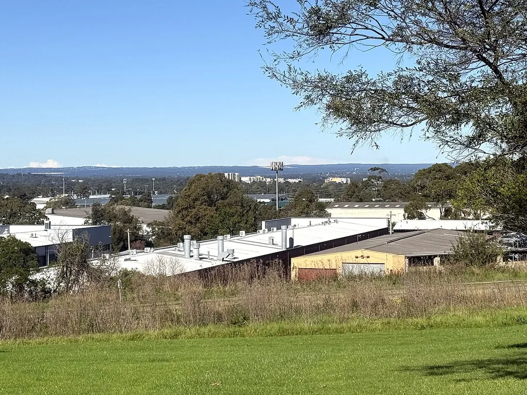 The skyline and urban tree canopy of Fairfield, western Sydney, NSW, Australia, as viewed from Canal Road Park, Greystanes