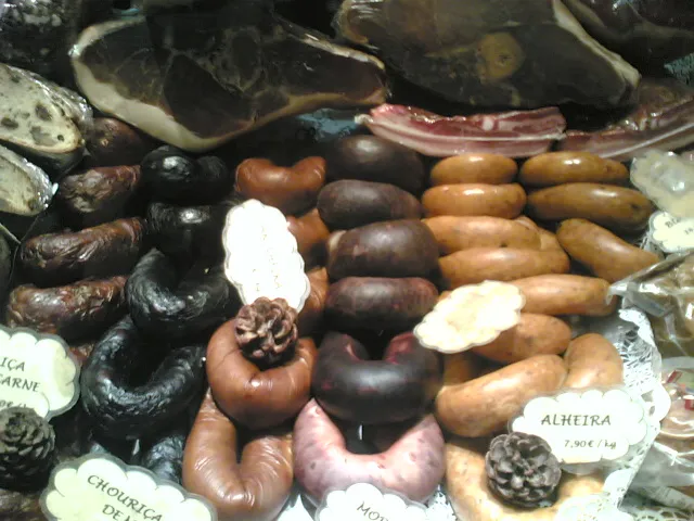 Portuguese sausages: chouriças, farinheiras, morcelas and alheiras, below. Presunto (cured ham), on top.