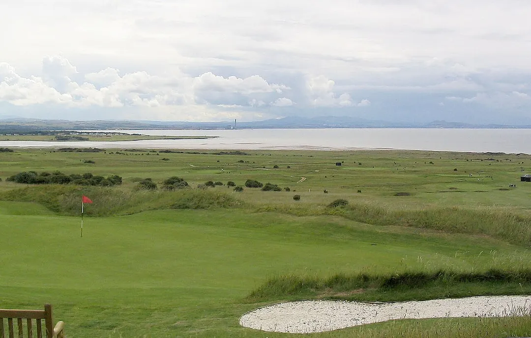 View from 7th tee of Gullane Number 1 Golf Course, over several holes of numbers 1, 2, and 3, Aberlady Bay and the Firth of Forth, to Arthur's Seat (Edinburgh) and the Pentland Hills. Photo taken by me, Martin Taylor, July 12, 2004.