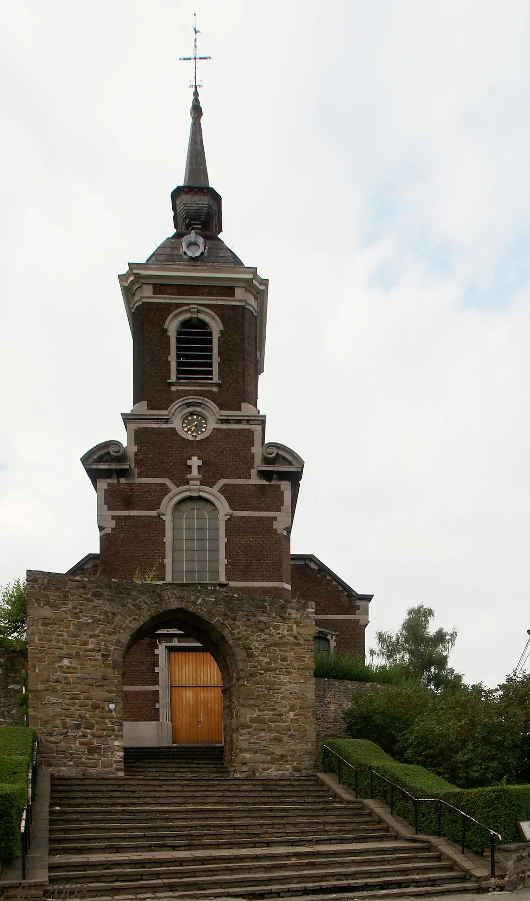 Haccourt (Belgium): Saint Hubert's Church and old castle's walls