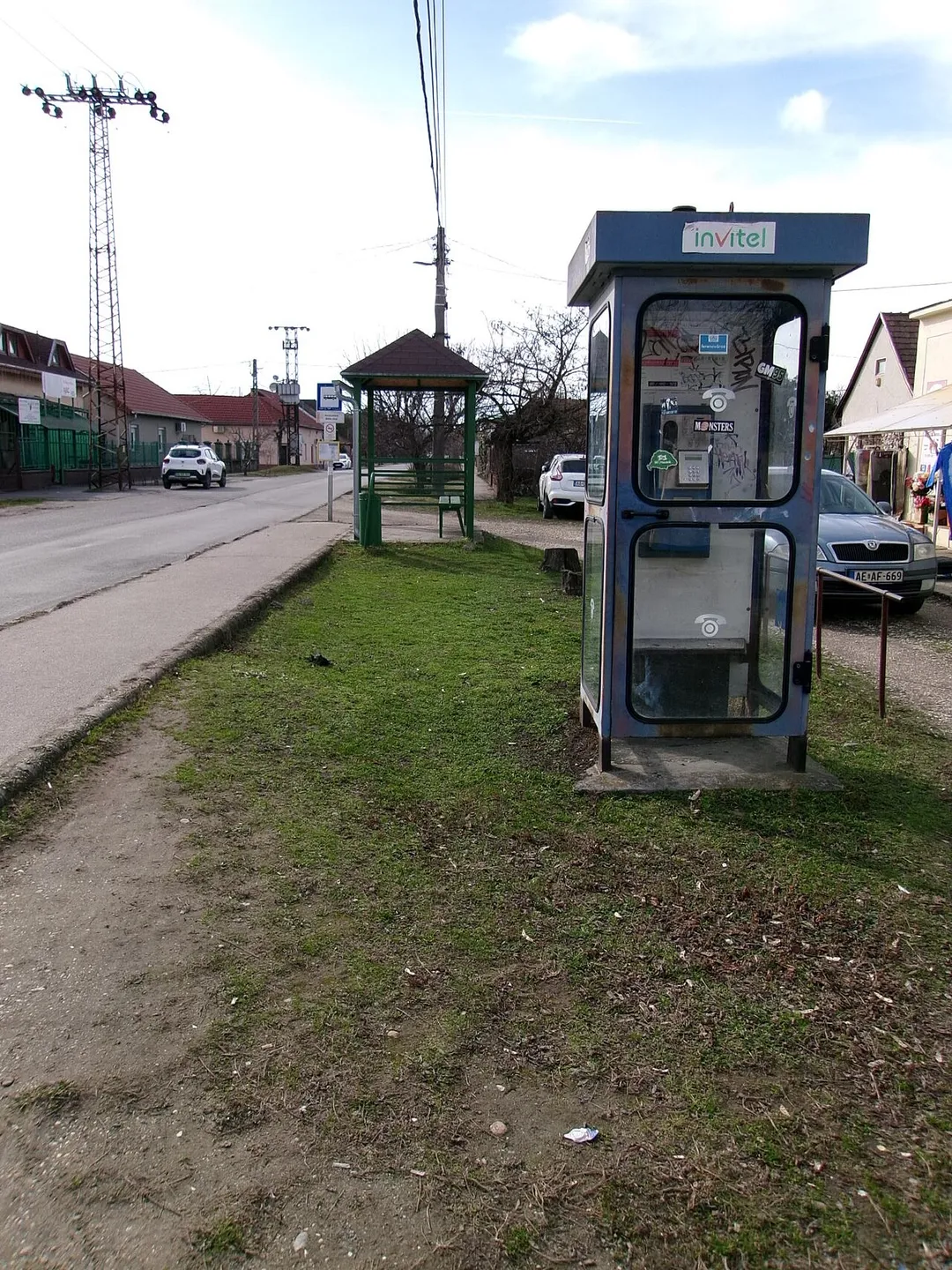 'Halásztelek, Béke utca' bus stop and an Invitel (coin) phone booth - Somogyi Béla Street, Halásztelek, Pest County, Hungary.