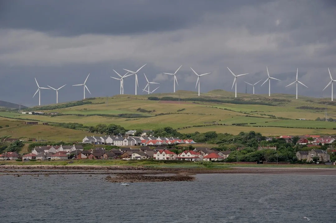 The skyline of Ardrossan, North Ayrshire, Scotland, is dominated by an enormous wind farm. The houses in front are on Eglinton Road.