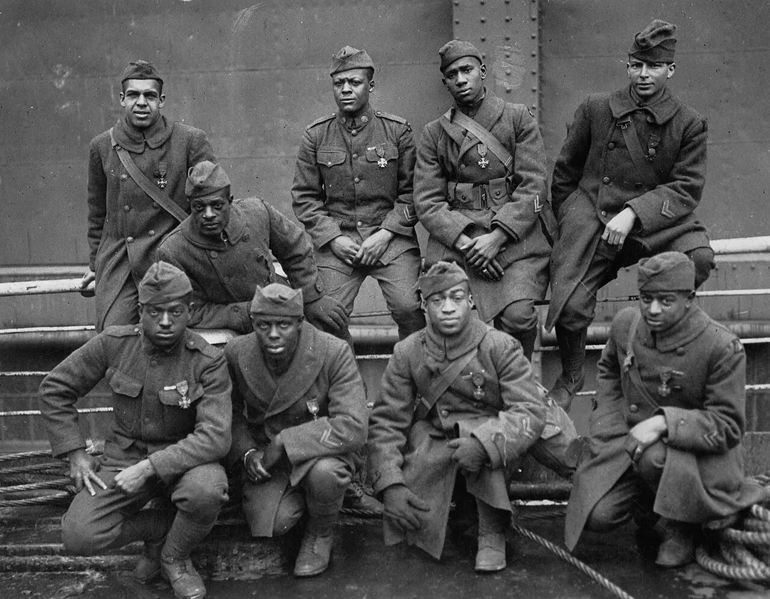 "Some of the colored men of the 369th (15th N.Y.) who won the Croix de Guerre for gallantry in action." Left to right. Front row: Pvt. Ed Williams, Herbert Taylor, Pvt. Leon Fraitor, Pvt. Ralph Hawkins. Back Row: Sgt. H. D. Prinas, Sgt. Dan Strorms, Pvt. Joe Williams, Pvt. Alfred Hanley, and Cpl. T. W. Taylor. 1998 print.
