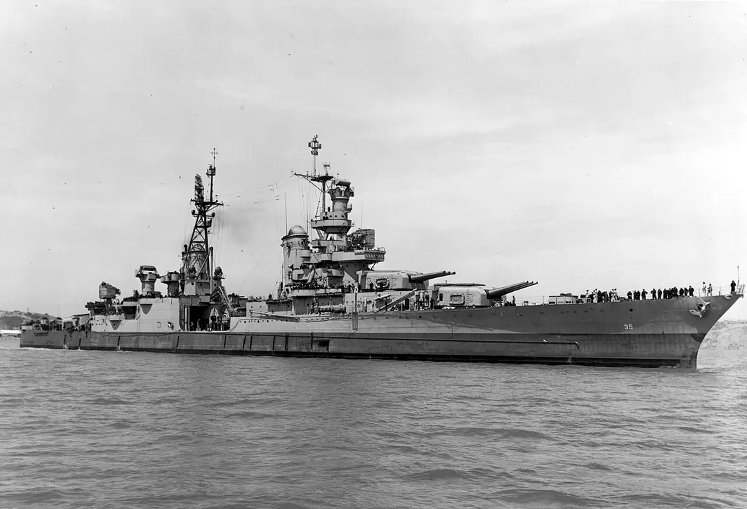 The U.S. Navy heavy cruiser USS Indianapolis (CA-35) off the Mare Island Naval Shipyard, California (USA), on 10 July 1945, after her final overhaul and repair of combat damage. The photo was taken before the ship delivered atomic bomb components to Tinian and just 20 days before she was sunk by a Japanese submarine.Photograph from the Bureau of Ships Collection in the U.S. National Archives.