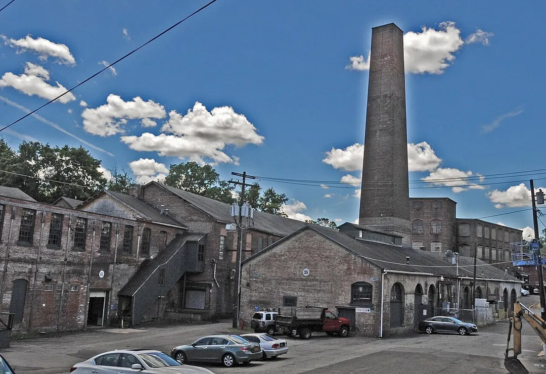 BUILT IN 1828 BY THE GARNER BROTHERS AS A CALICO PRINTING PLANT.  30 BUILDINGS ARE INCLUDED IN THE COMPLEX WHICH IS NOW KNOWN AS THE GARNERVILLE ARTS AND INDUSTRIAL CENTER.