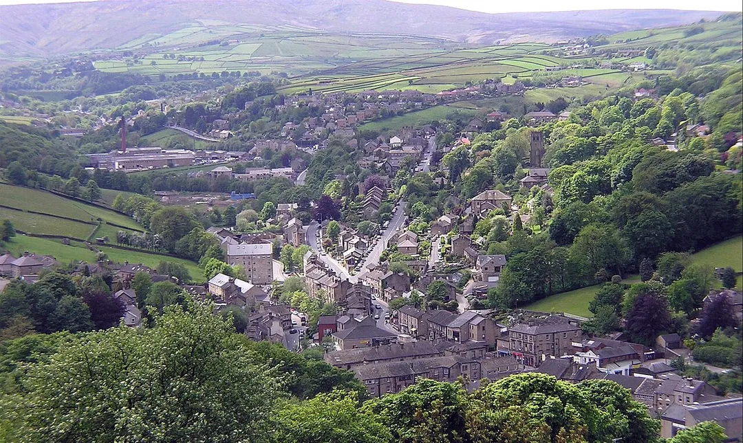 View of Holmfirth from Cliffs above Cliff Road, view is taken facing southwest. The A6024 (Woodhead Road) goes from the centre of the village to the top left of the photo