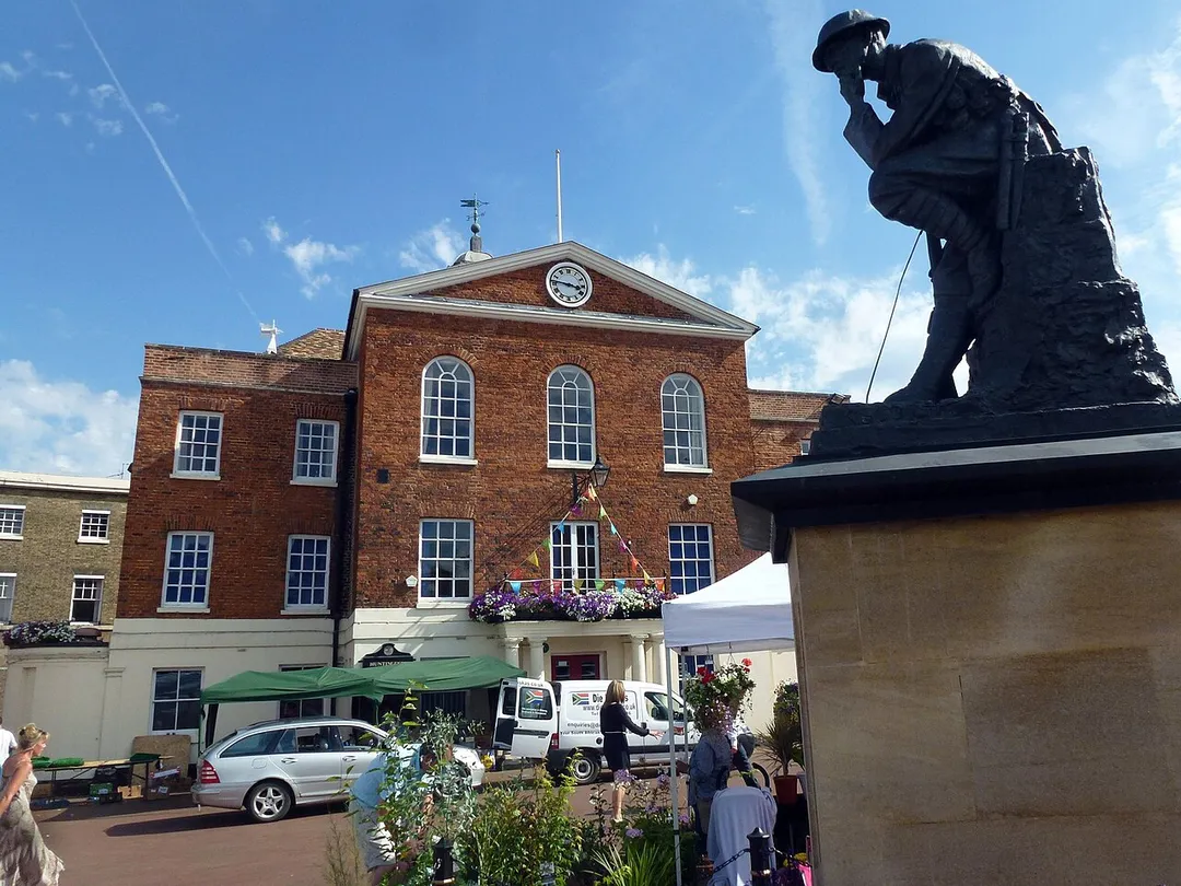 Old Town Hall and the Thinking Soldier War Memorial in Huntingdon, Cambridgeshire.