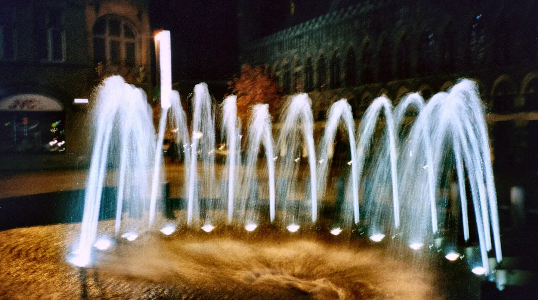 Night shot of the fountain in the Grote Markt outside of the Cloth Hall in Ieper/Ypres, Belgium.