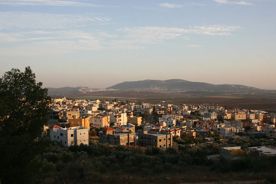 View of Iksal looking southwest from the gravel road that runs behind the town to the east of it.