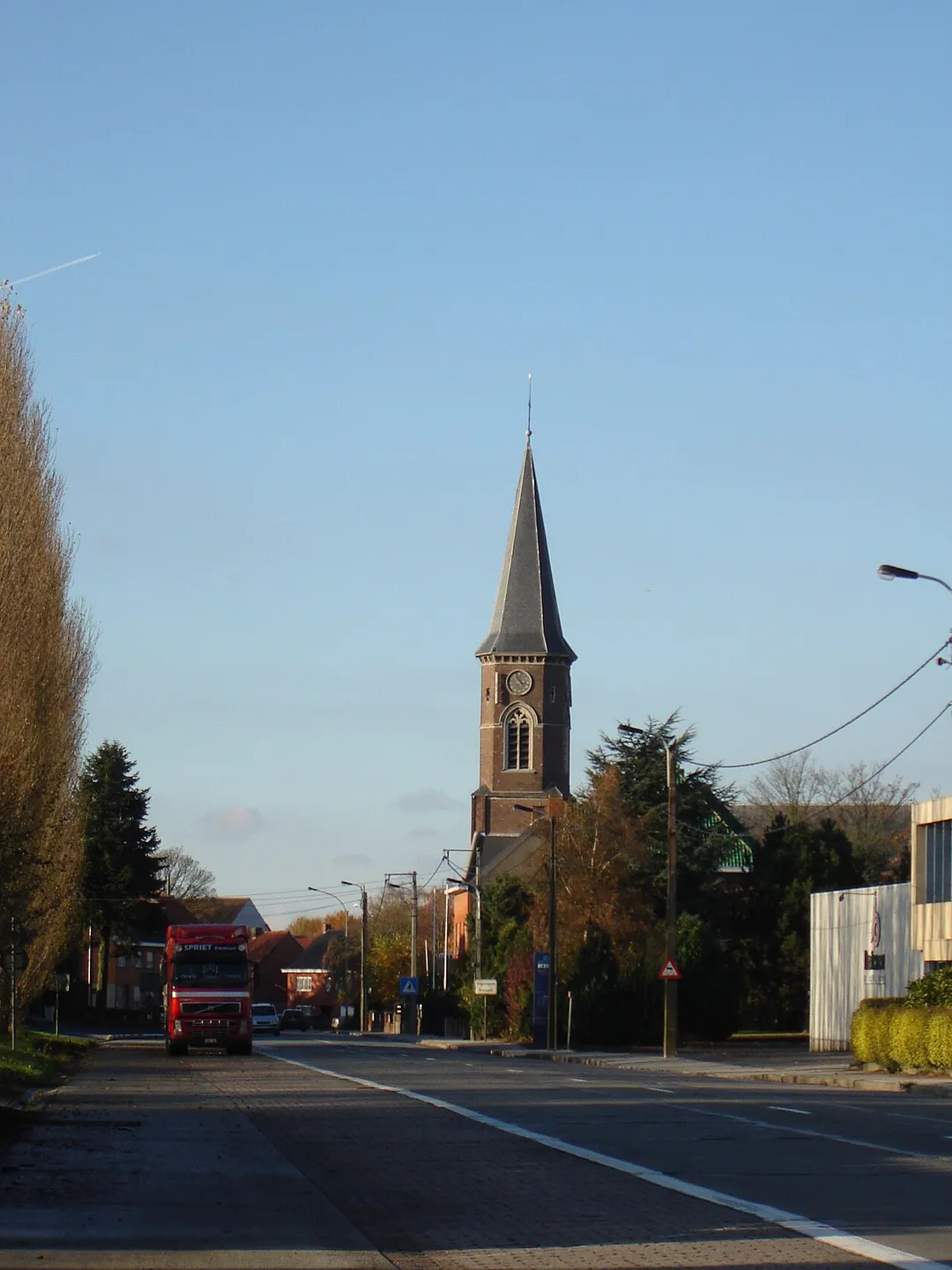 Village of Ingooigem, with Sint-Antoniuskerk along the N36 (Stijn Streuvelsstraat) Ingooigem, Anzegem, West-Flanders, Belgium