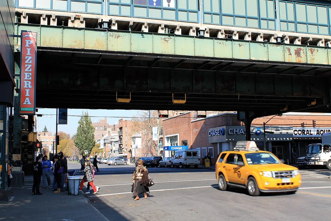 The intersection of 75th Street and Roosevelt Avenue, under the 74th Street – Broadway subway station.