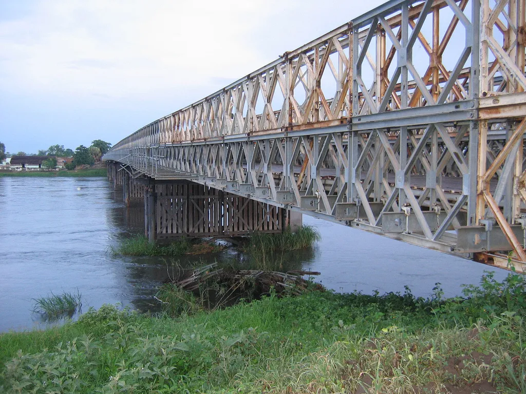steel bridge over the White Nile in Juba, Equatoria, South Sudan. The Juba Bridge is based on Mabey Bridge Compact 200 range and comprises two 3.15m single lane, six-span bridges installed side by side, with a total length of 252 metres. External footwalks have also been fitted to protect pedestrians. The original Juba Nile Bridge crossing was formed from two WW2-era Bailey Bridges. However, following an earlier collapse of one of the bridges, two replacement Mabey Compact 200 bridges were installed in 2006.