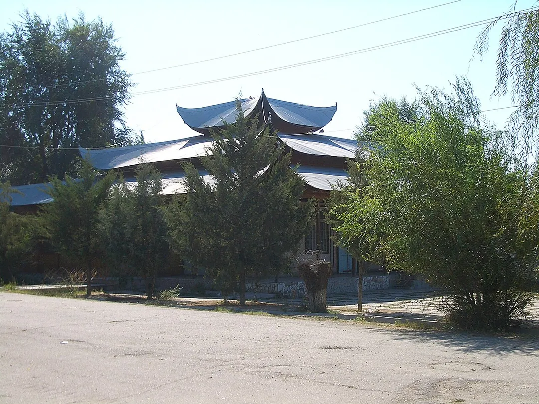 An apparently unused Chinese-style building in the center (Lenin St) of Milyanfan, a Dungan village in Chuy Province, Kyrgyzstan.