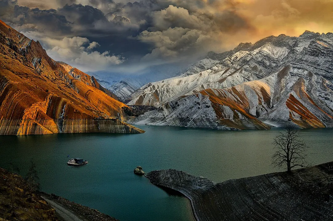 The Amir kabir Dam was built as a multi-purpose dam to provide tap water for Tehran alongside agricultural development in Karaj. It supplies the irrigation demand of over 50,000 hectares (120,000 acres) of farm land near Karaj. The power plant has been connected to the national electricity network for over 46 years and has a capacity of 90 megawatts. The lake behind the dam is a touristic attraction while being a natural habitat for rainbow trout. With its sailing and water-skiing facilities, the dam is a popular weekend summer resort