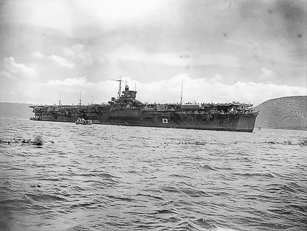 AWM Caption: Rabaul, New Britain. 1946-01-31. The Japanese Navy aircraft carrier Katsuragi in Simpson Harbour. The ship was transporting 5000 Japanese troops from the Solomon Islands to Japan and had called at Rabaul to refuel.