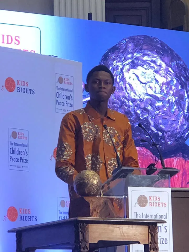 Abraham M. Keita with the International Children’s Peace Prize award