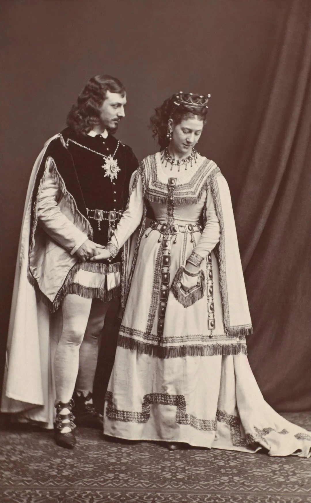 W.H. Kendal as Prince Philamir and Madge Robertson (a.k.a. Madge Kendal) as Princess Zeolide  in W.S. Gilbert's The Palace of Truth, original 1870 production. 9.3cm x 5.7cm. The Kendals claimed copyright on this, but, however accurate that copyright claim was, it's definitely expired now.