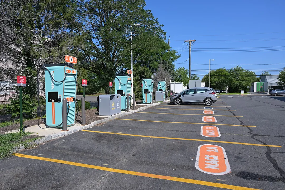 A gray Chevrolet Bolt charges at an IONNA fast charging station at a Wawa in Kendall Park, New Jersey.