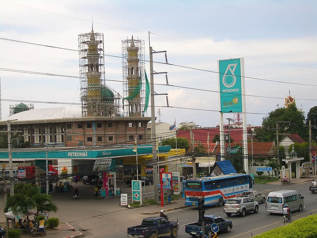 Sukhumvit Road (Highway No.3, an important north-south highway) in Pattaya, Thailand. A mosque and a Christian church can be seen.