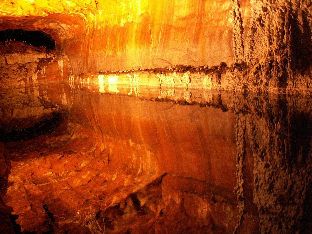 Inside the KhewRa Salt mines, Above the line is Salt and Below the line is Water where one can see the reflection.