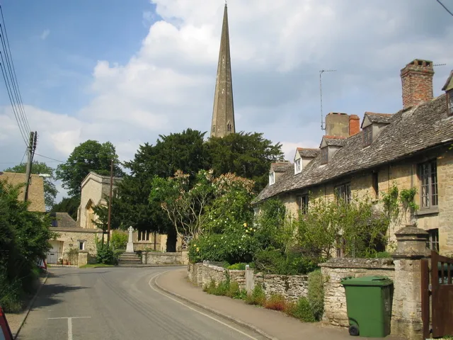 Church Street, Kidlington, Oxfordshire, looking north to the spire of St Mary's parish church. The cottages on the right are 74–78 Church Street.