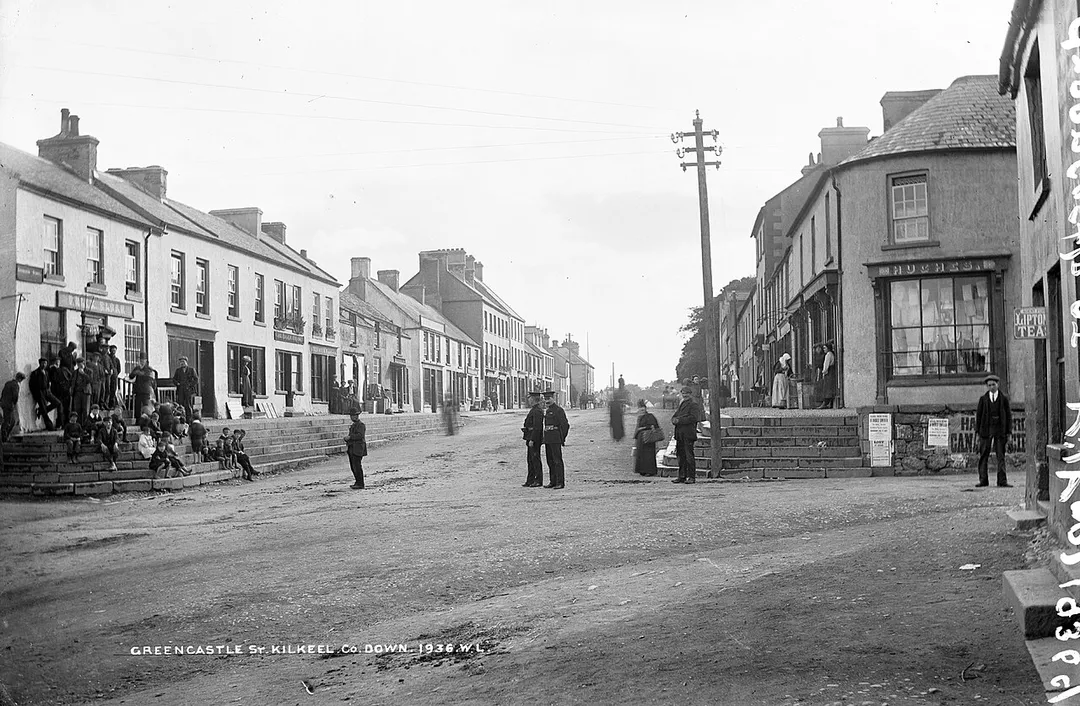 Hoping that the the posters for A Sacred Cantata at the parish church might help us to date this photograph of Greencastle Street in Kilkeel, Co. Down! When I really squint, I'm getting Wednesday Aug 14 1907?? See what you all think. Failing that, the sign for Hanneford's Canadian Circus should be of use.
NLI Ref.: L_CAB_01936