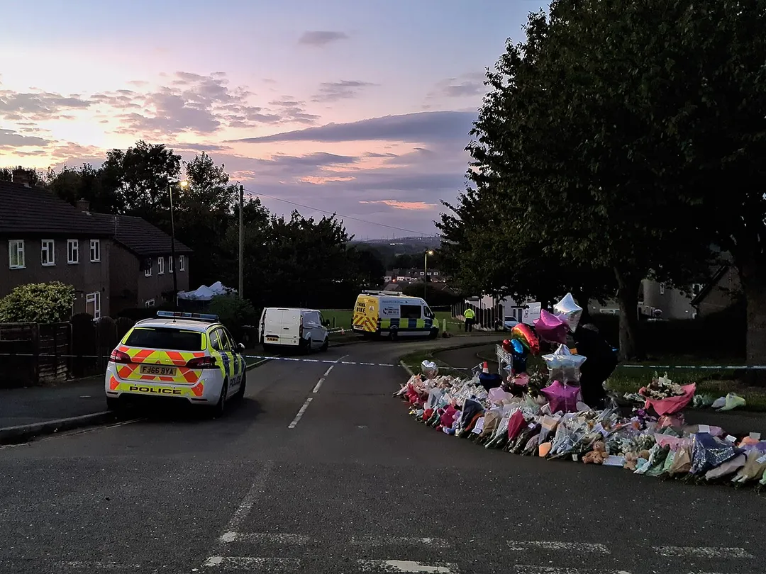 Flowers and balloons left at the police cordon on Chandos Crescent, Killamarsh, Sheffield following the murder of three children and one adult at a residential property on 19 September 2021. Photo taken at sunset on 23 September 2021.
